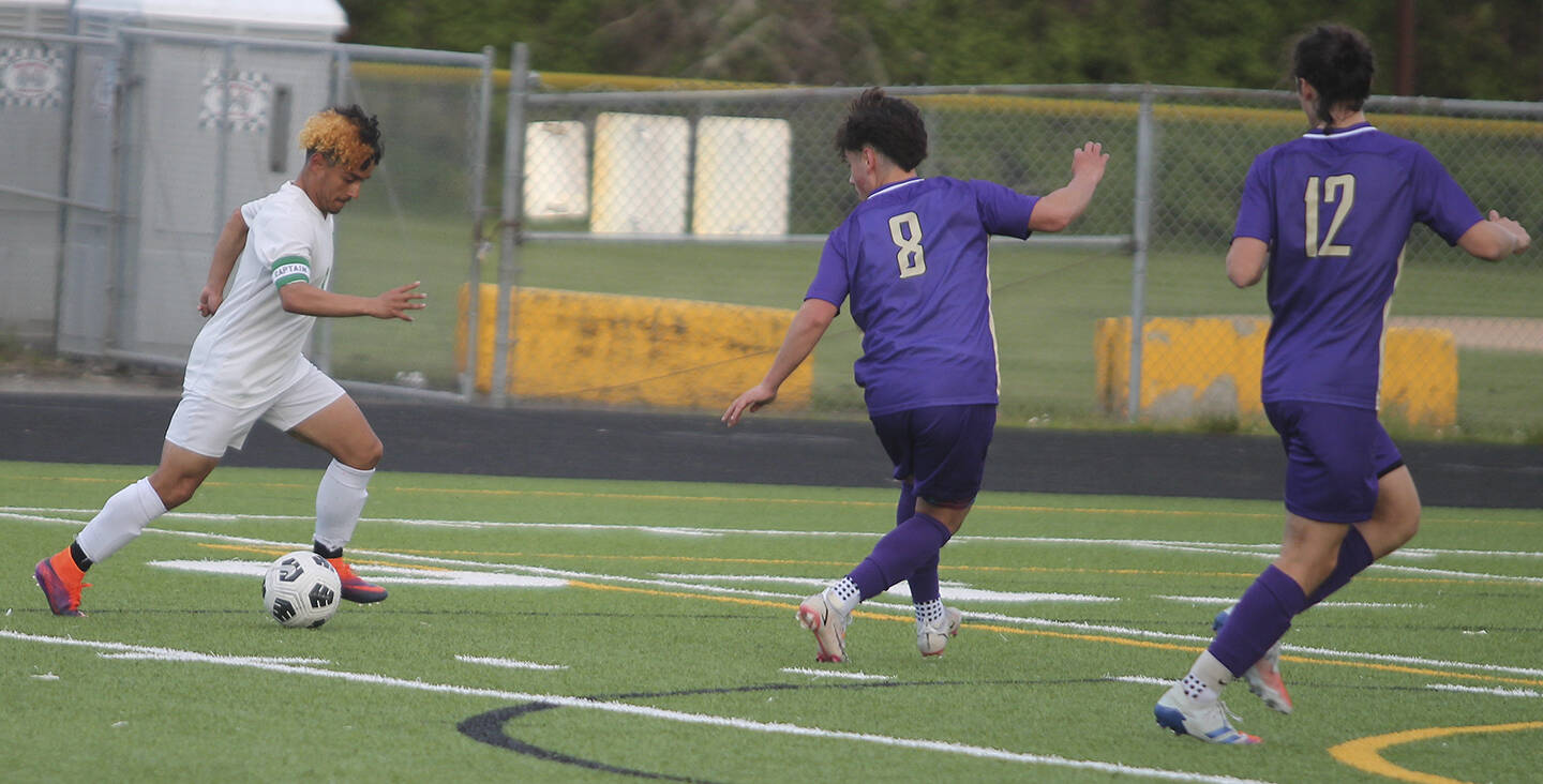 NK's Angel Chavez (8), a junior forward, and Jackson Reeves (12) rush back to defend to keep Clover Park from scoring a breakaway goal. Steve Powell/North Kitsap Herald photos