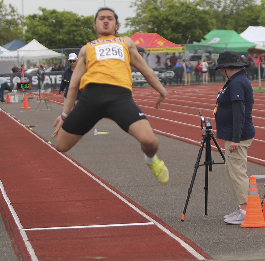 Viking Lincoln Castillo competes in the long jump at state.