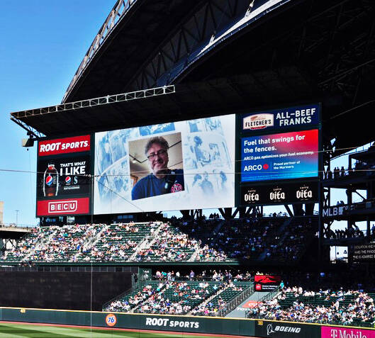 Former Seattle Seahawks security and customer service worker Dave Musselman was recognized by the Seattle Mariners for his conflict resolution skills and personal appearance.