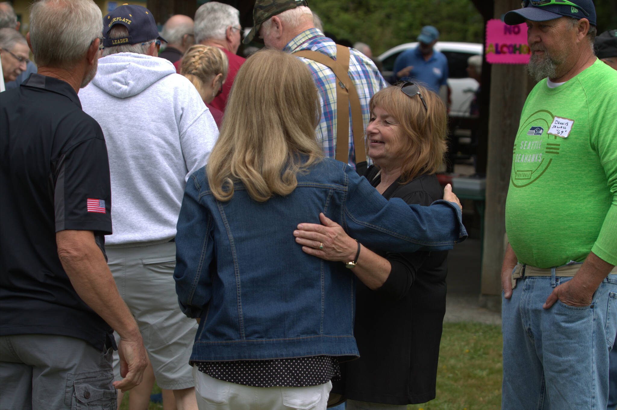 Friends embrace at the annual alumni picnic. Elisha Meyer/Port Orchard Independent Photos