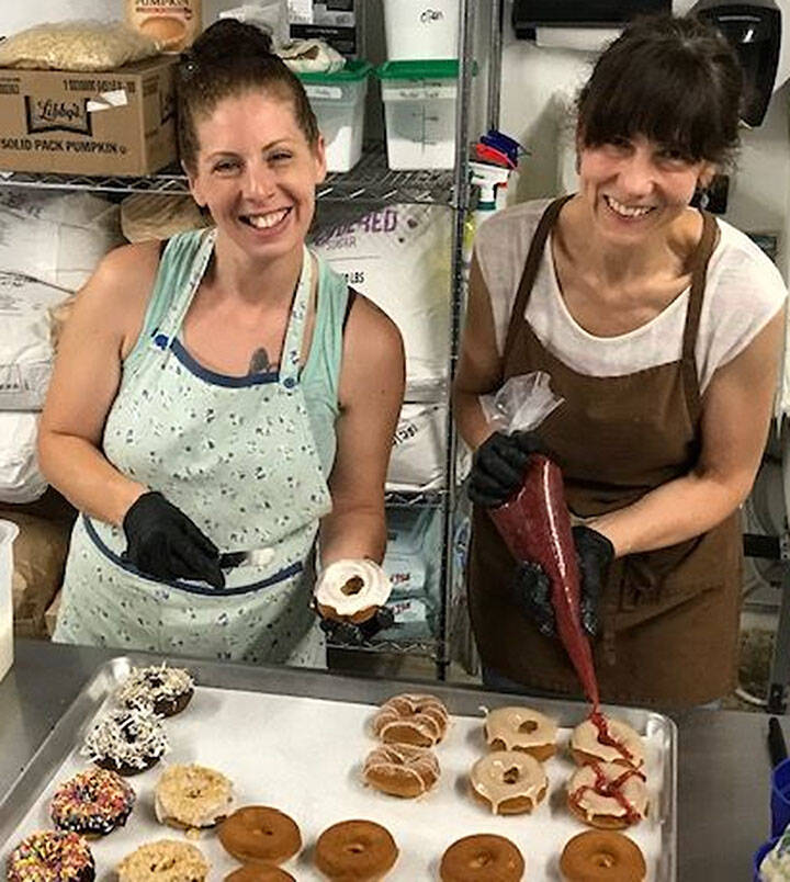 Mike De Felice/Port Orchard Independent
Natalie Smith and Nina Zubal enjoy baking for Dude’s Donuts.
