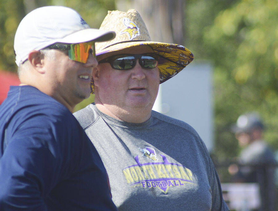 NK coach Jeff Weible, right, talks with another coach at the 7 on 7 tourney.