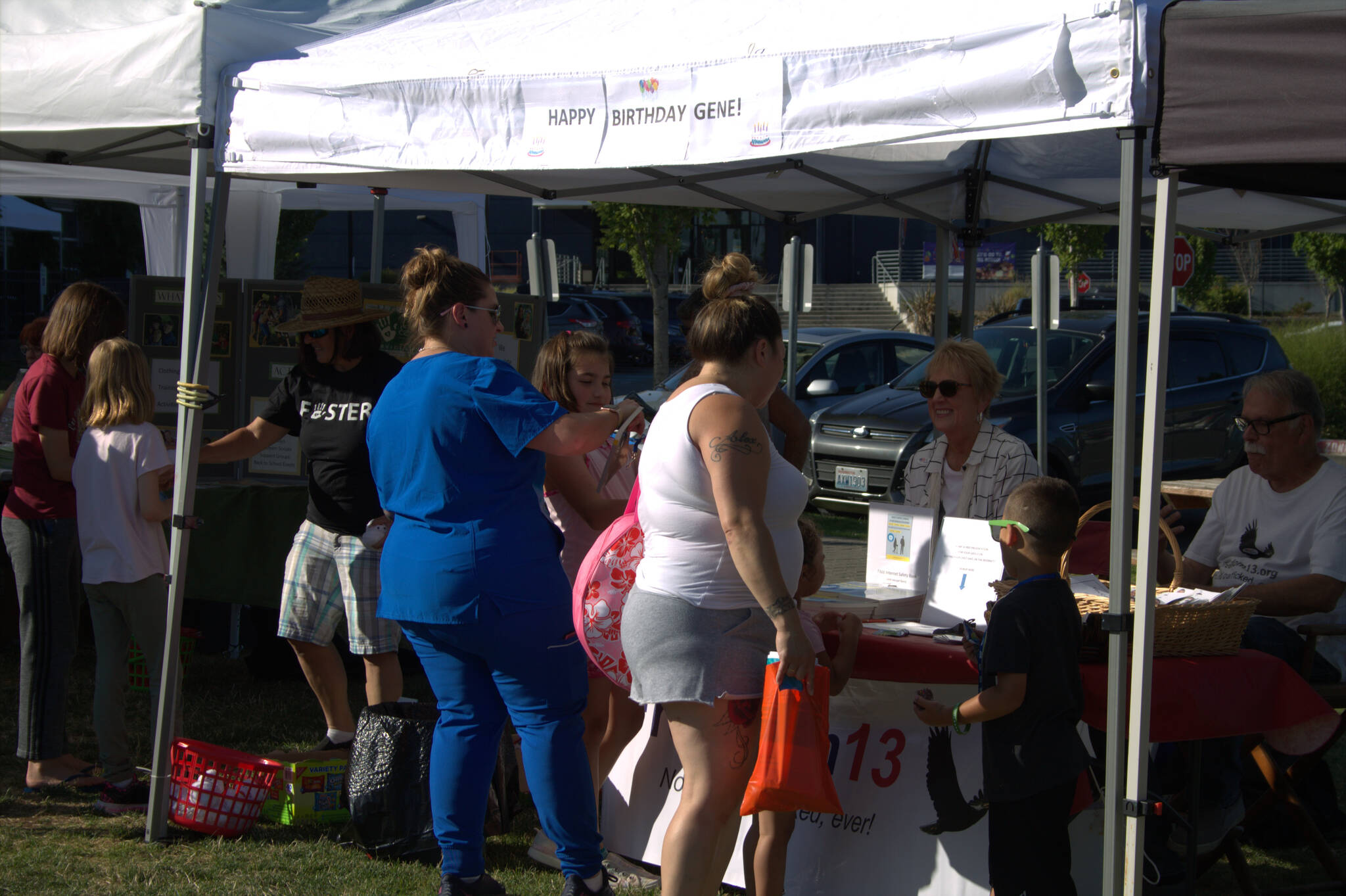 Families gather around one of the many booths at National Night Out. Elisha Meyer/Port Orchard Independent Photos