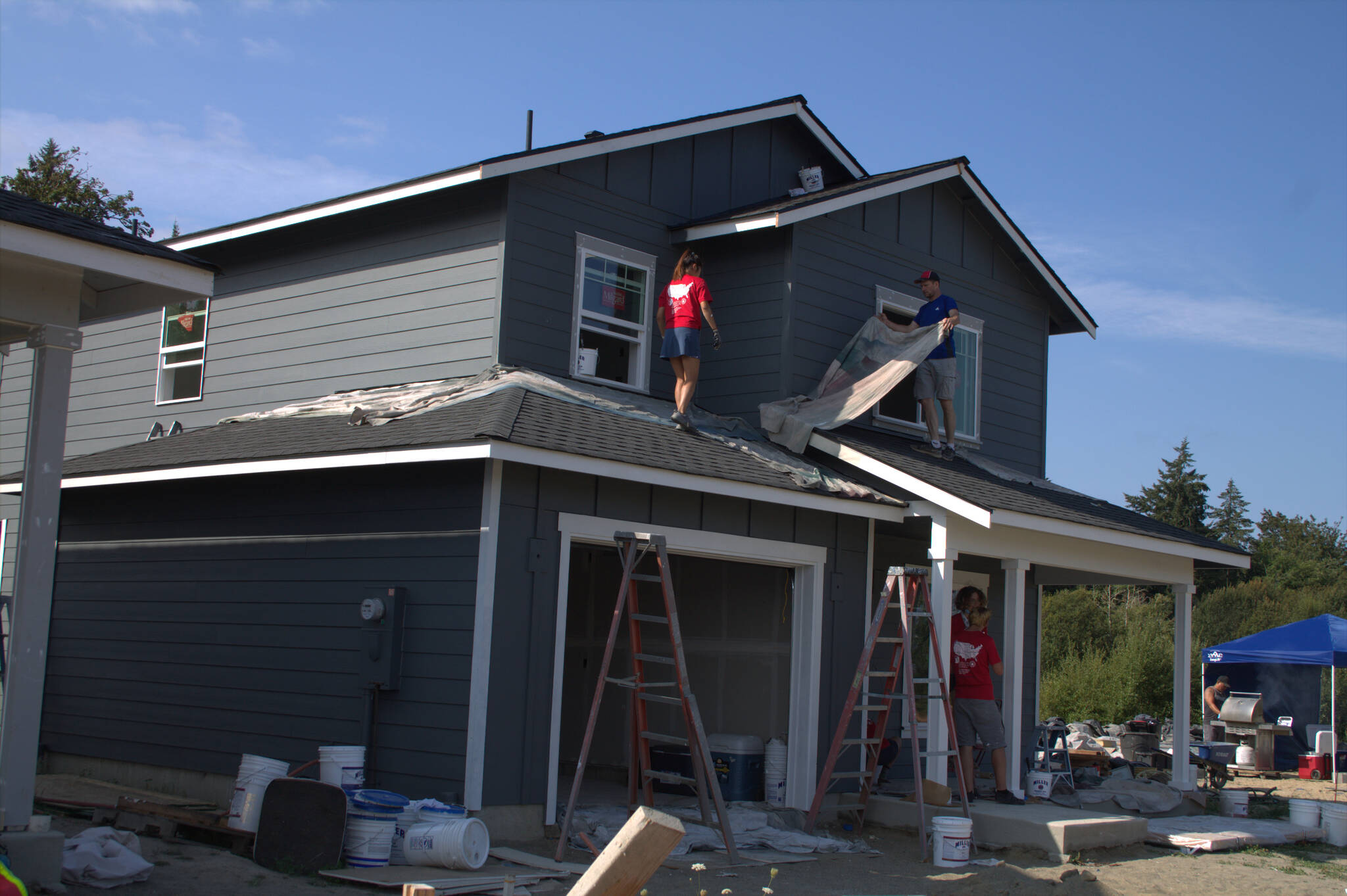 Volunteers continue work on one of the houses in the Sherman Ridge community.