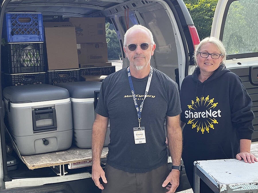 Volunteers Jim Johnsen and Susie Stevens staff ShareNet's Mobile Food Pantry. Courtesy Photo