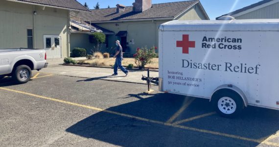 Red Cross vehicles and trailers sit outside the Silverdale United Methodist Church, which was activated as an emergency shelter for the fire victims. Elisha Meyer/Kitsap News Group