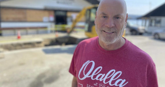 Gregg Olsen stands in front of the Olalla Bay Market. Courtesy Photos