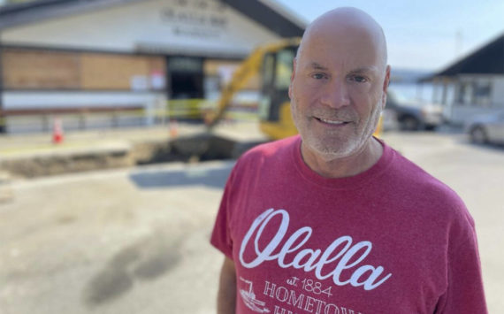 Gregg Olsen stands in front of the Olalla Bay Market. Courtesy Photos