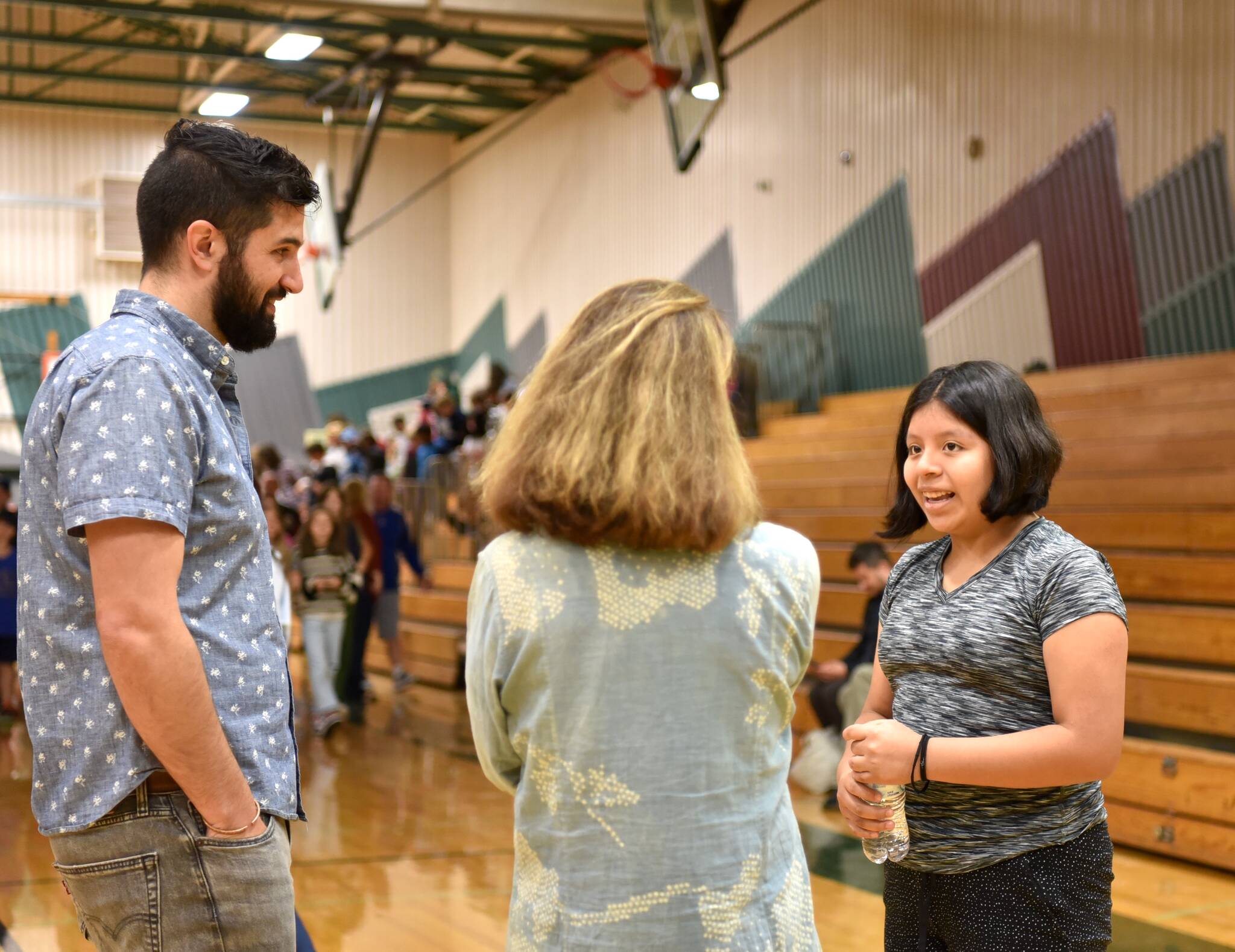 Woodward Middle School student Antonia Paxtor Vicente speaks with filmmaker Zach Ingrasci and eighth-grade school counselor Patricia Beers about Guatemala. Nancy Treder/Kitsap News Group Photos