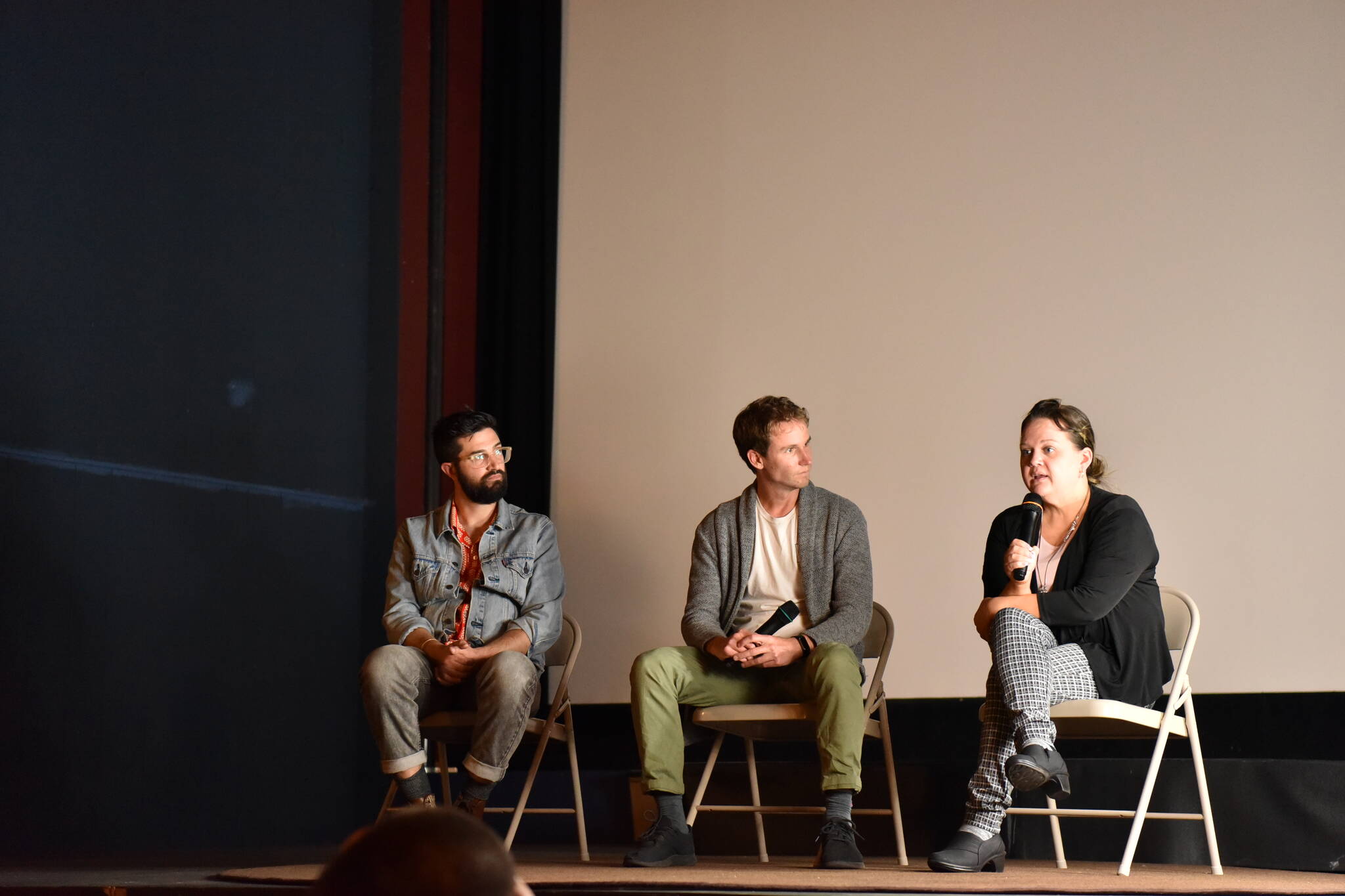 Filmmakers Zach Ignasci and Chris Temple answer questions with state Rep. Tarra Simmons during a panel discussion after the premiere of "Free to Care" at the Lynwood Theatre.