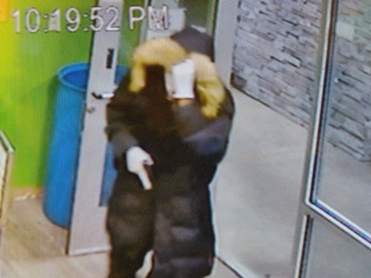 Surveillance video shows one of the robbers entering Kitsap Cannabis while appearing to draw a weapon. Courtesy Photos