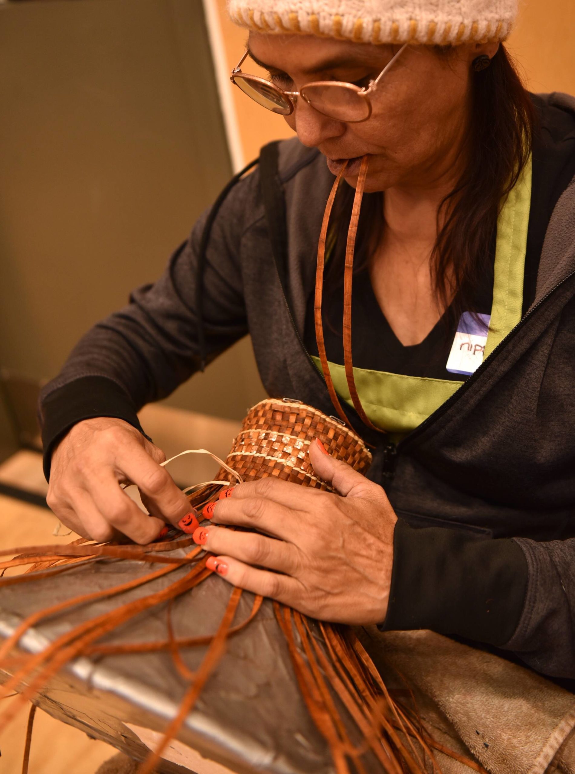Suquamish tribal member Kippie Joe makes a potlatch hat from cedar bark. Nancy Treder/Kitsap News Group Photos
