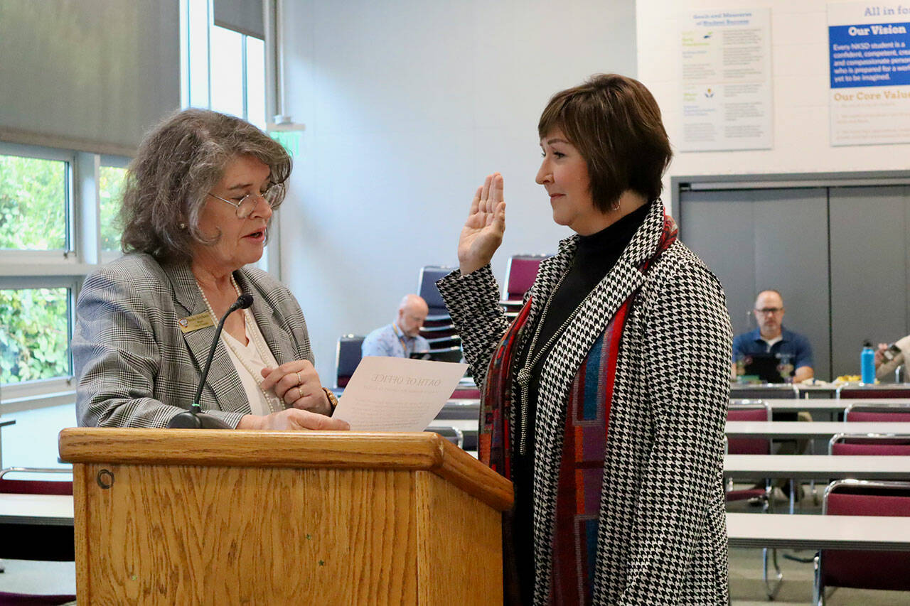 New North Kitsap school board member Barbara Waggoner is sworn in by Poulsbo Mayor Becky Erickson. Courtesy Photos