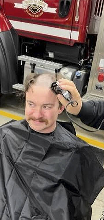 Firefighters shave their heads since many already have mustaches. Courtesy Photo