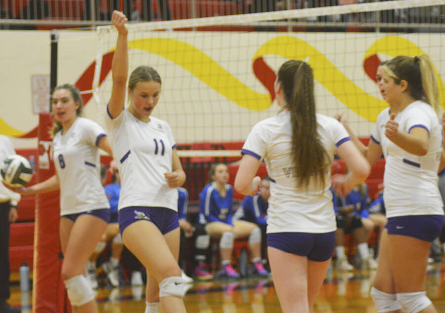 Maddie Pryde (11) of NK celebrates a point with her team. Steve Powell/Kitsap News Group Photos
