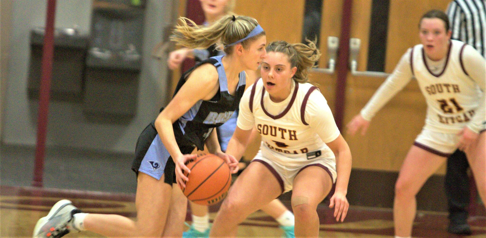 Junior Kyla Hoisington guards a Rams player during the first half of the game.