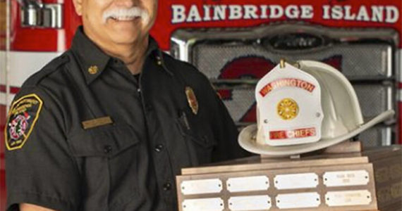 Hank Teran of Bainbridge with his state Fire Chief of the Year award. Courtesy Photo
