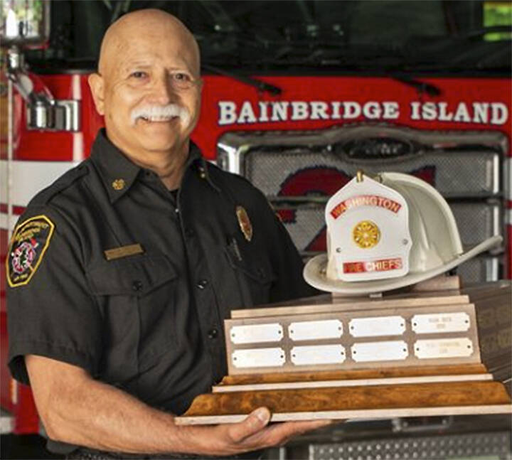 Hank Teran of Bainbridge with his state Fire Chief of the Year award. Courtesy Photo