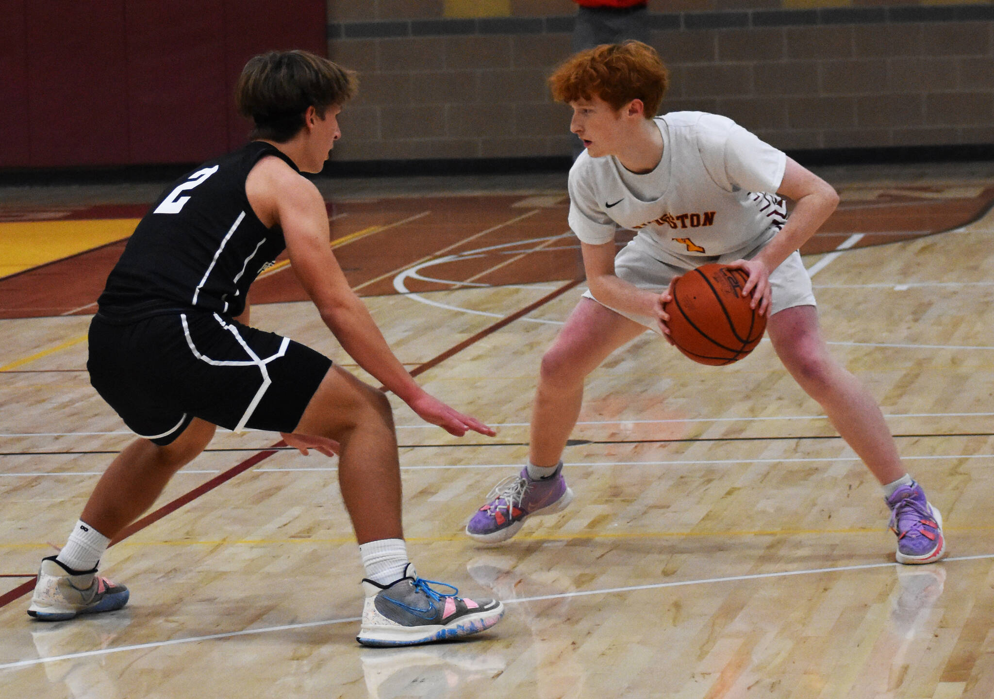 Cash Hubbard looks to drive past Mason Chmielewski. Nicholas Zeller-Singh/Kitsap News Group Photos