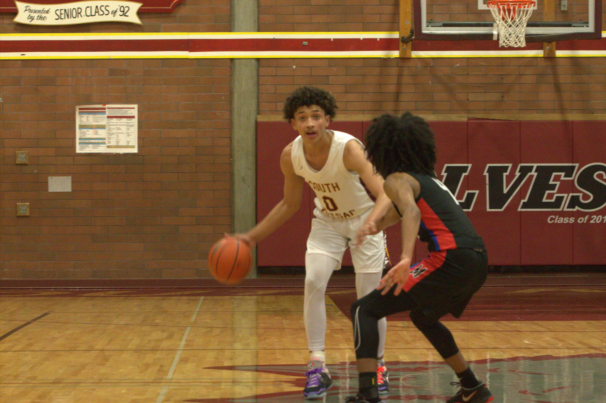 Senior Kendryck Miller sets up the offense in the first half. Elisha Meyer/Kitsap News Group