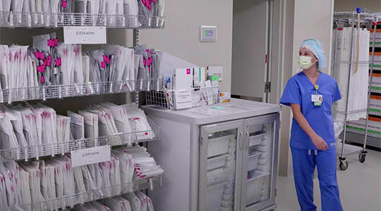 A nurse goes into a room to get a file. Courtesy Photos