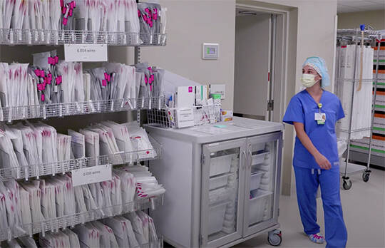A nurse goes into a room to get a file. Courtesy Photos