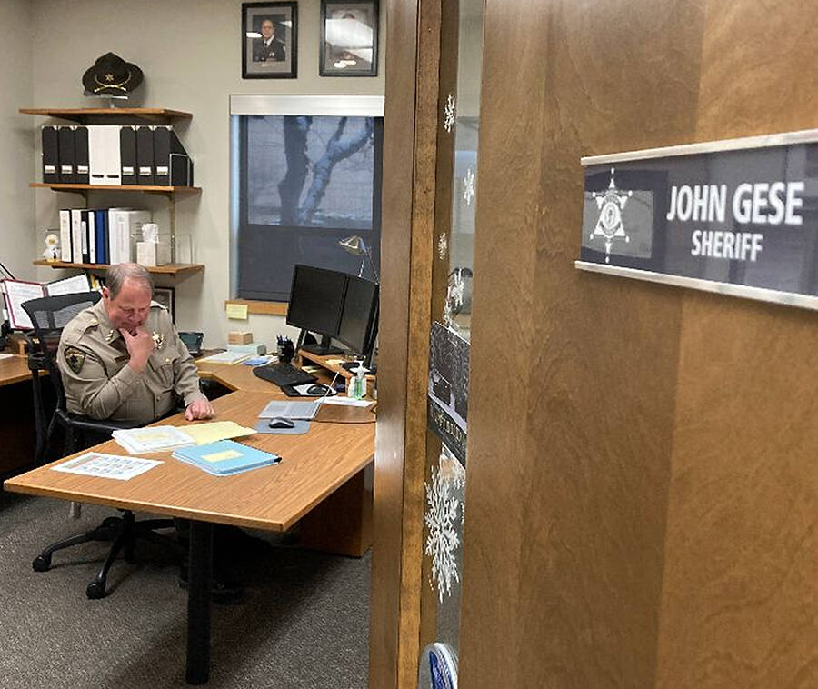 Sheriff John Gese works in his office just before Christmas. Courtesy Photo