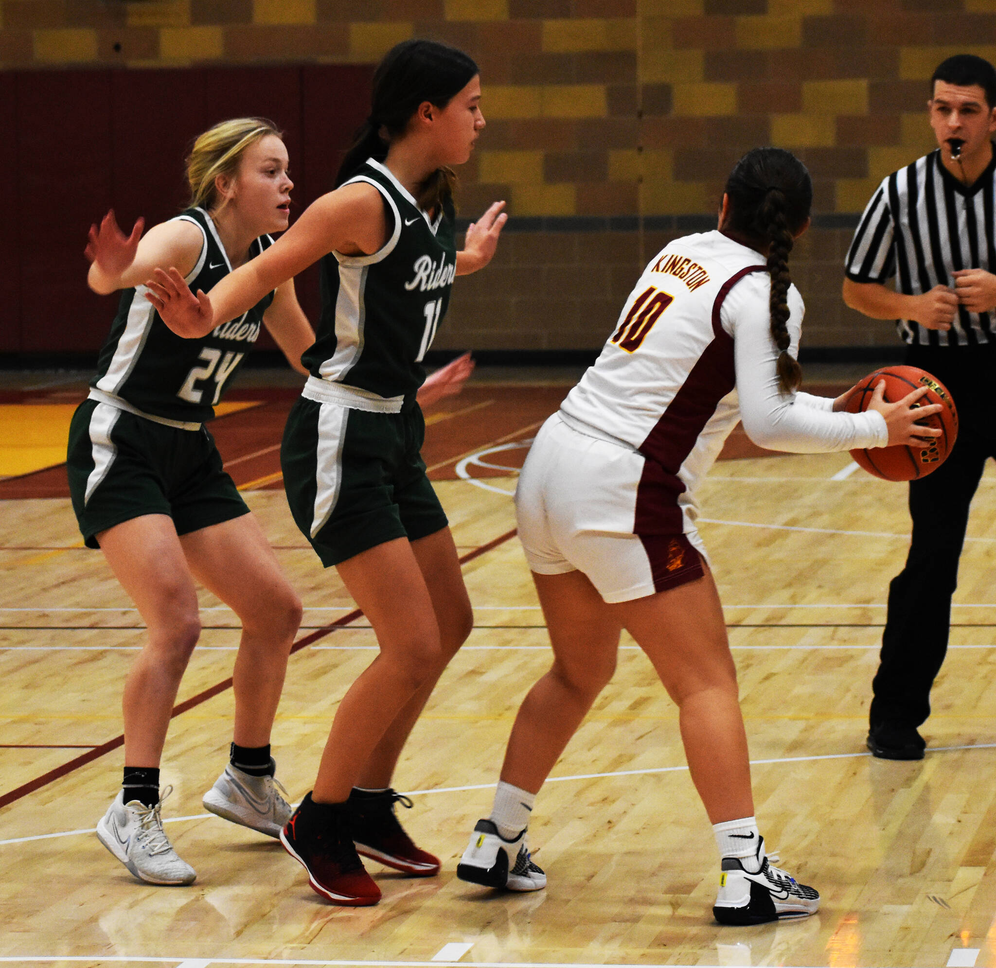 Jayla Moon gets double-teamed by Port Angeles after scoring a few three-point shots. Nicholas Zeller-Singh/Kitsap News Group Photos