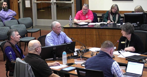 Loren Bast (far left), executive director of Bainbridge Prepares, former Bainbridge firefighter Luke Carpenter (left), Poulsbo Mayor Becky Erickson (right) and the City Council discuss the city’s emergency preparednes. Courtesy Photo