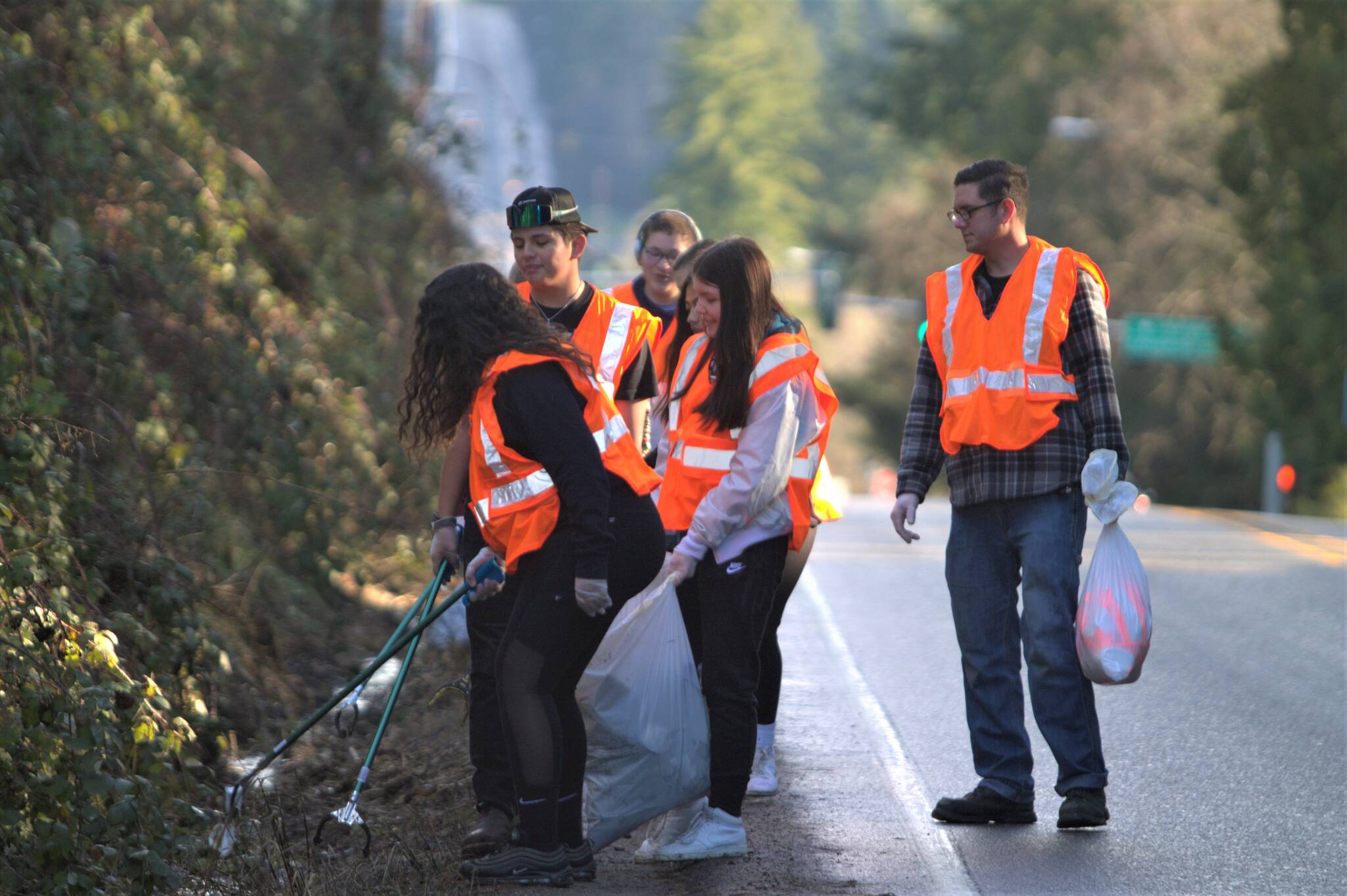 South Kitsap students clean up trash off the side of SE Sedgwick Road. Elisha Meyer/Kitsap News Group