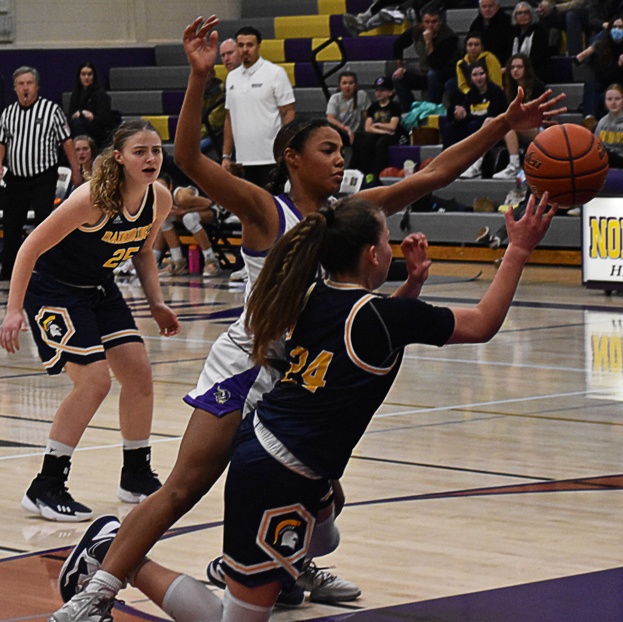 Coriana McMillan forces a Bainbridge turnover with full-court pressure.