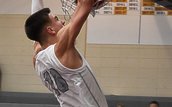 Cade Orness finished the game with three dunks against Kingston. Nicholas Zeller-Singh/Kitsap News Group Photos