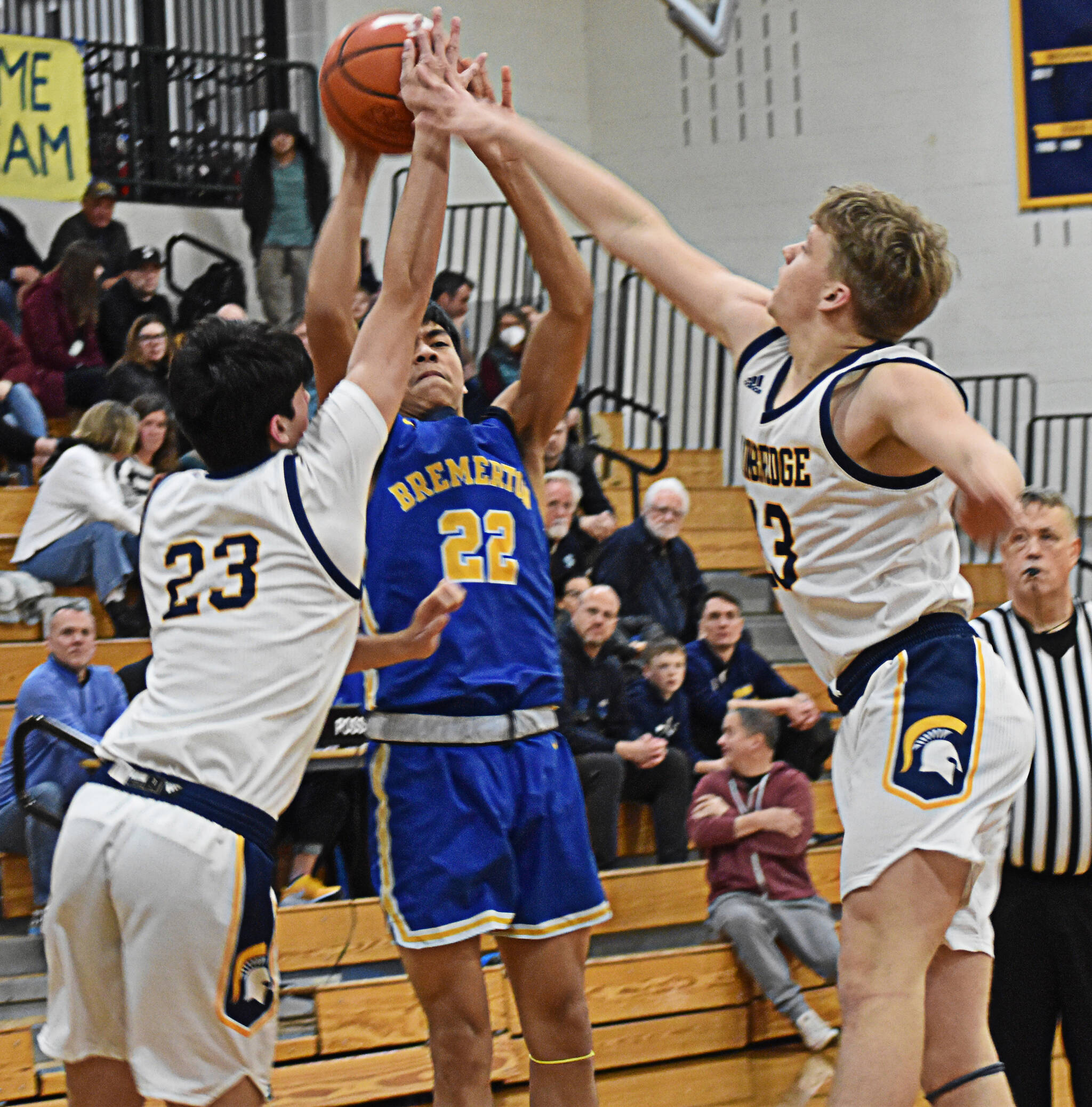 Spartans Cooper Benjamin and Caleb Durrance block Knight Isaiah Cadengo’s shot attempt. Nicholas Zeller-Singh/Kitsap News Group Photos