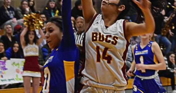 Tatiana Fontes-Lawrence makes a tough basket underneath the hoop to end a dry spell for Kingston. Nicholas Zeller-Singh/Kitsap News Group Photos