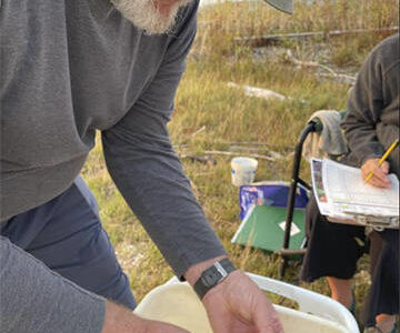 Volunteers measure crabs they catch in their traps. Courtesy Photo