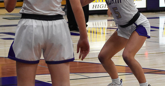 Evelyn Beers shoots a free throw while Avery Kline prepares to grab the rebound. Nicholas Zeller-Singh/Kitsap News Group Photos