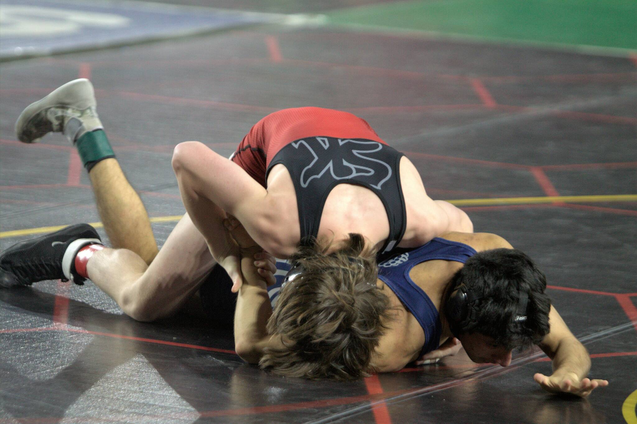 Brennen Williams of SK goes to work against another wrestler at the Mat Classic. Elisha Meyer/Kitsap News Group