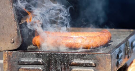 A halved ‘Big Boy’ sausage gets fired up for a hungry customer. Elisha Meyer/Kitsap News Group Photos