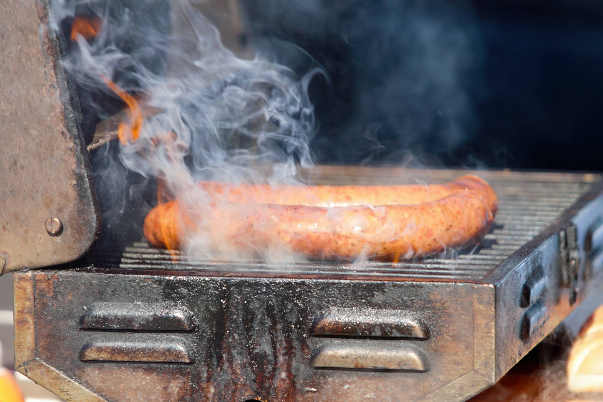 A halved ‘Big Boy’ sausage gets fired up for a hungry customer. Elisha Meyer/Kitsap News Group Photos