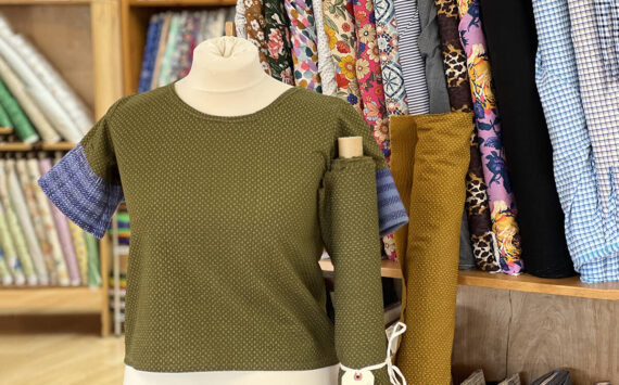 Army green seersucker cotton Scout tee, made at Esther's Fabrics using a pattern by Grainline Studio. Handwoven sleeves by Norn Goods (on Bainbridge Island). Courtesy Esther's Fabrics