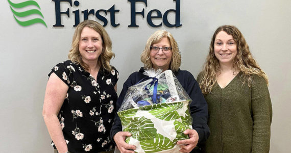 Branch Manager Nicole Pruden (right) and Asst. Branch Manager Heather Little (left) with winning customer at First Fed Sequim Village.