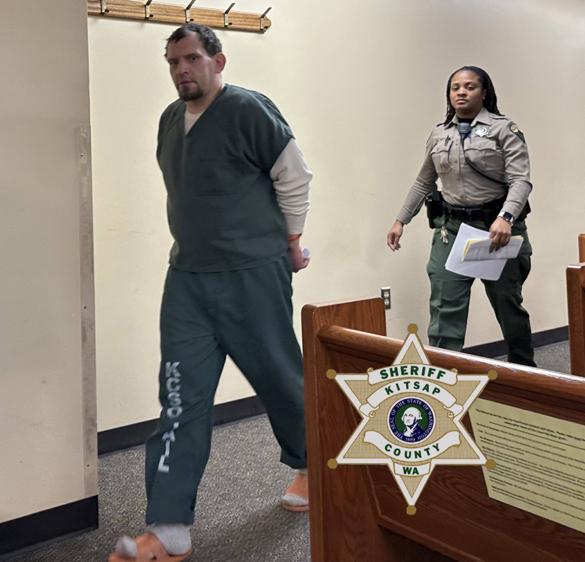 Shaun Rose walks handcuffed through the courtroom accompanied by law enforcement. Kitsap County Sheriff’s Office courtesy photo