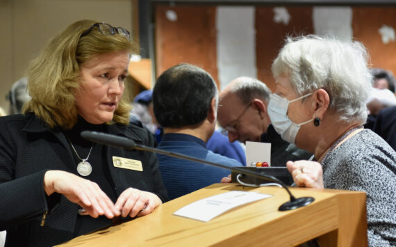 State Sen. Christine Rolfes speaks with a constituent after the Town Hall meeting. Nancy Treder/Kitsap News Group photos