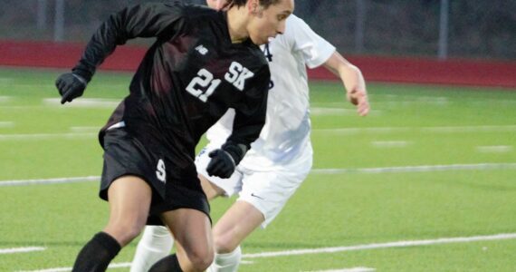 Senior Nathaniel Smith works to push the ball downfield in the first half against Gig Harbor. Elisha Meyer/Kitsap News Group