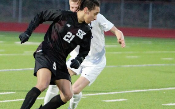 Senior Nathaniel Smith works to push the ball downfield in the first half against Gig Harbor. Elisha Meyer/Kitsap News Group