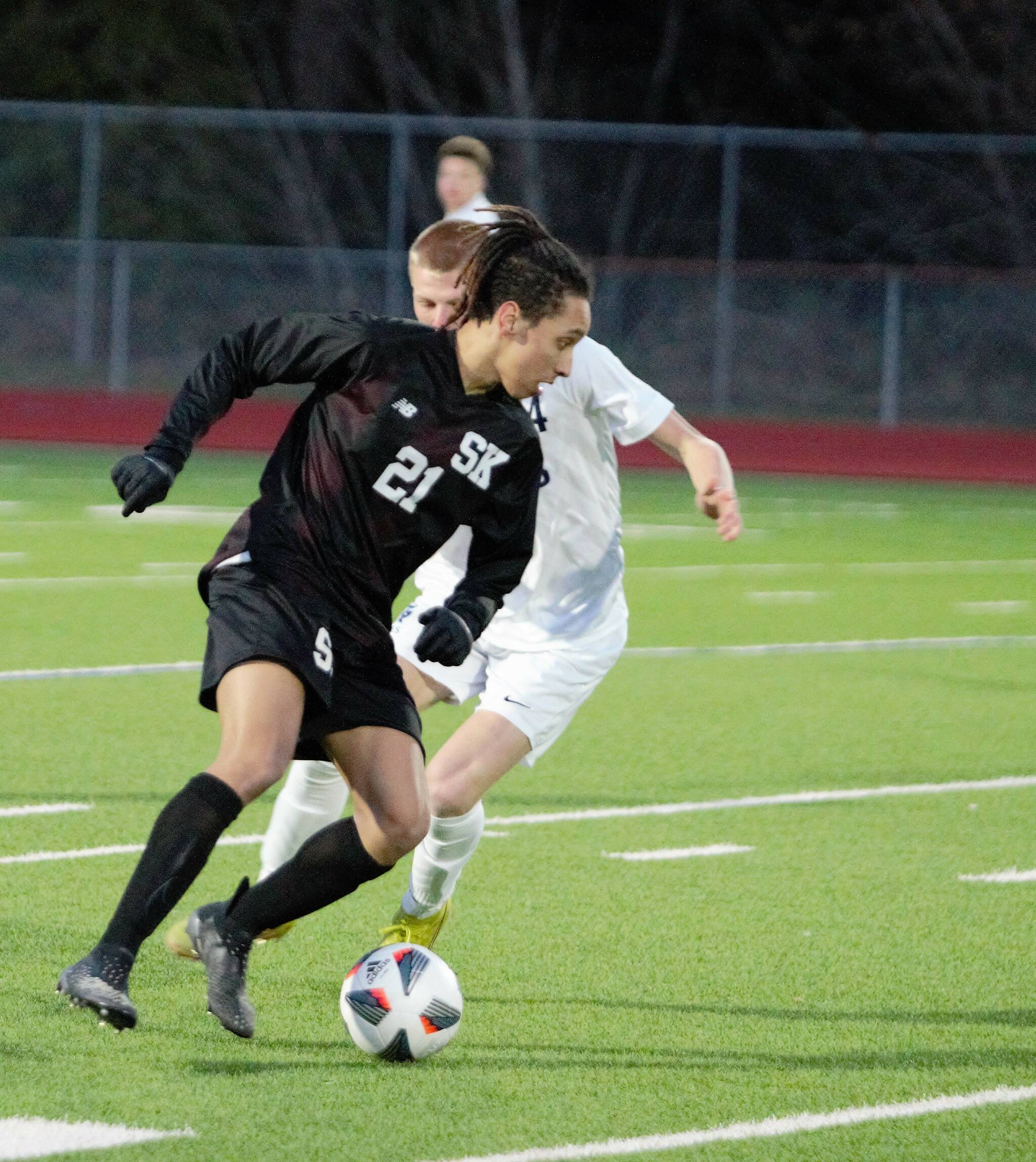 Senior Nathaniel Smith works to push the ball downfield in the first half against Gig Harbor. Elisha Meyer/Kitsap News Group