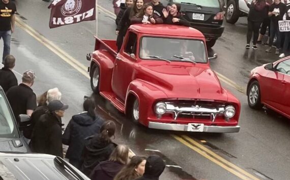 Students wave from the back of a truck to their supporters along Bay Street. Photos courtesy of Eric Worden