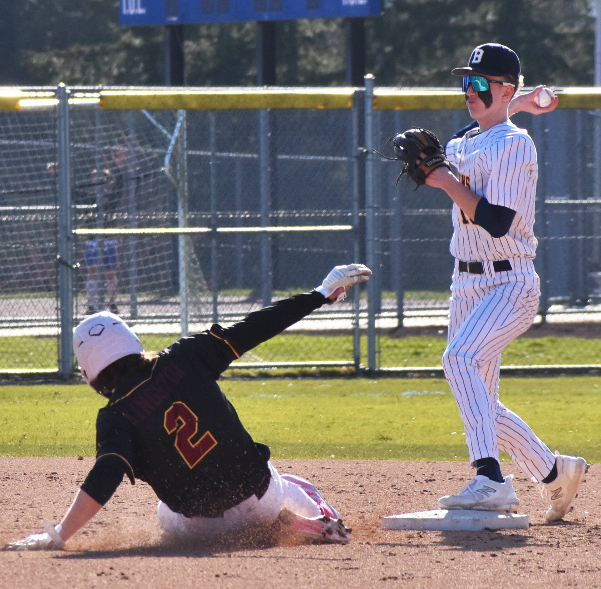 Bainbridge’s Braden French gets the force out at second base. Nicholas Zeller-Singh/Kitsap News Group Photos