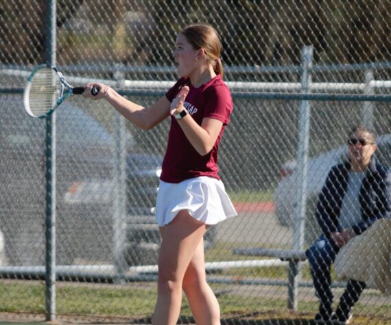 Junior Hailey Deese keeps the rally going with a forehand shot towards her opponent. Elisha Meyer/Kitsap News Group