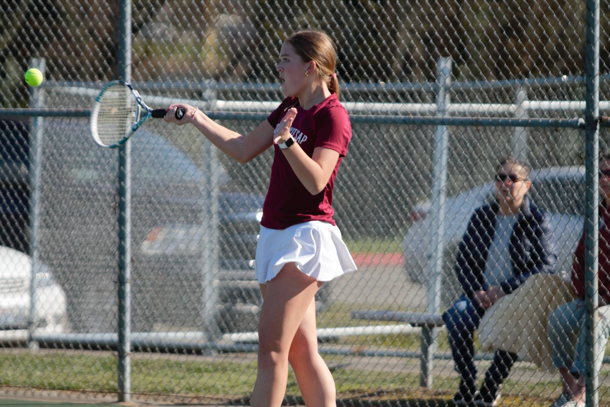 Junior Hailey Deese keeps the rally going with a forehand shot towards her opponent. Elisha Meyer/Kitsap News Group